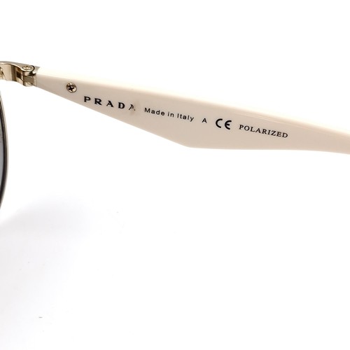 529 - A pair of aviator  Prada sunglasses marked 'Made in Italy' on frames. Serial no: 60-13. Lenses with ... 