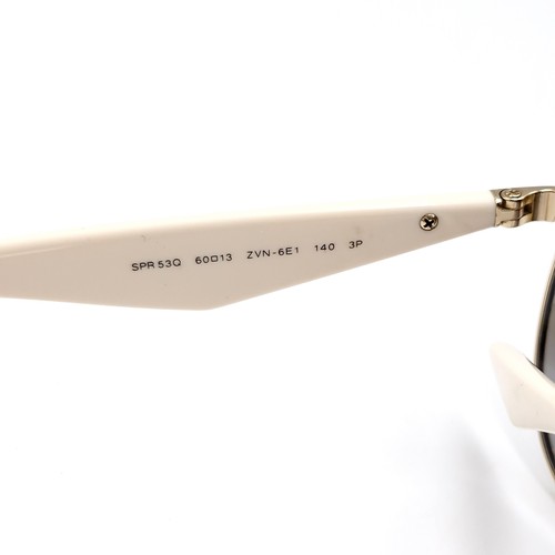 529 - A pair of aviator  Prada sunglasses marked 'Made in Italy' on frames. Serial no: 60-13. Lenses with ... 