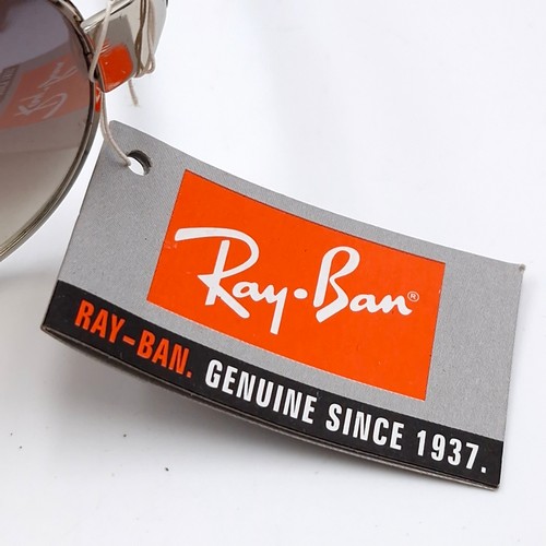 564 - A pair of Ray-Ban aviator sunglasses with raised motifs to frames. Lenses clear with no scratches, w... 