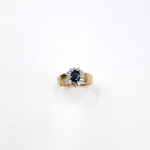 593 - Star lot : A nine carat gold diamond and sapphire stone ring with wide band mount. Size - L. Weight ... 