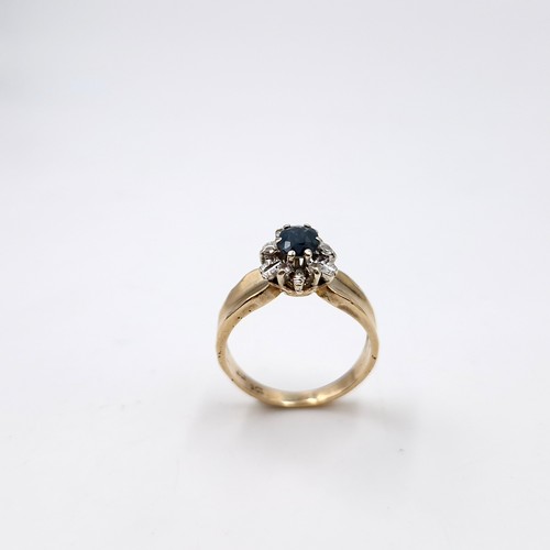 593 - Star lot : A nine carat gold diamond and sapphire stone ring with wide band mount. Size - L. Weight ... 