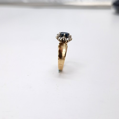 593 - Star lot : A nine carat gold diamond and sapphire stone ring with wide band mount. Size - L. Weight ... 