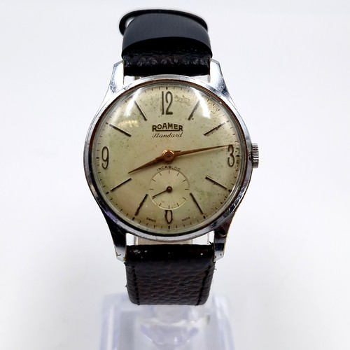 960 - A vintage gents Roamer Standard Incabloc Swiss made, stainless steel watch paired with a black genui... 