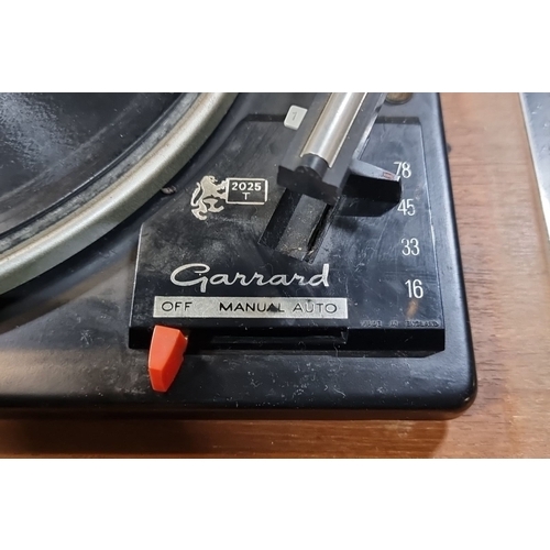 485 - Garrard Model 2025T turntable, circa 1960s. Vintage wooden casing, manual/auto operation.