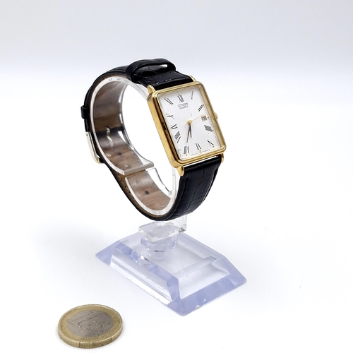 27 - A Citizen quartz tank style wristwatch with roman numeral dial, sweep second hand and date just with... 