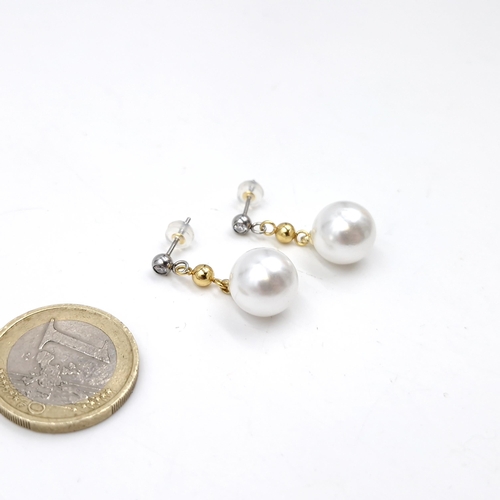 42 - A pair of diamond and pearl drop earrings. Weight - 3.25 grams.