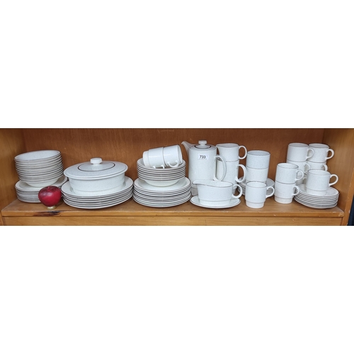 A large collection of Poole Pottery bone china. Includes complete tea set, bowls and plates. Made in England and all with marks to base.