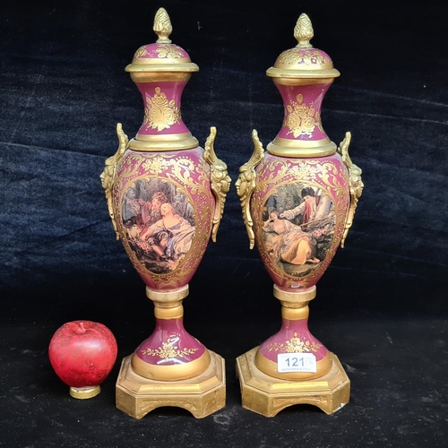 121 - Star Lot : A fabulous large pair of French Sevres style gilt and enameled brass vases.  Featuring ha... 