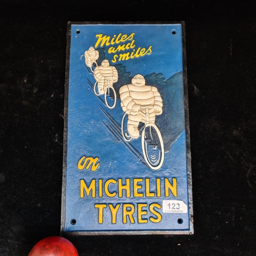 123 - A heavy cast iron painted wall sign for Michelin Tyres.