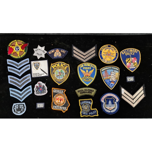 248 - A selection of Police and Marine badges including Louisiana State Police, Baltimore Police and Royal... 