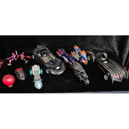 259 - A collection of superhero figurines and vehicles. Includes Batman on his Batcycle, Spiderman and the... 