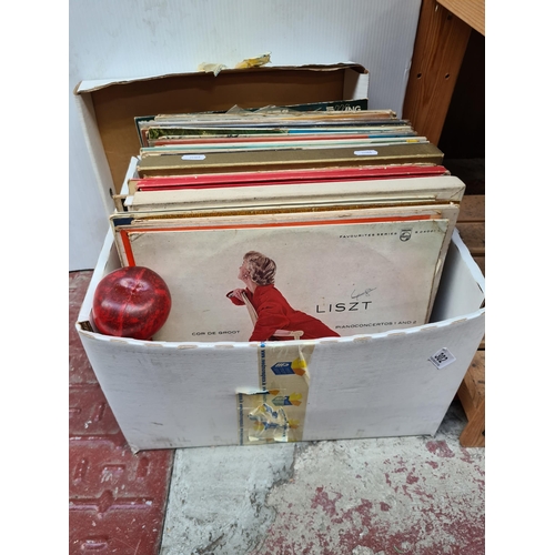 302 - A box of 40+ vinyl record albums from artists including The Dubliners, Suzanne Vega etc