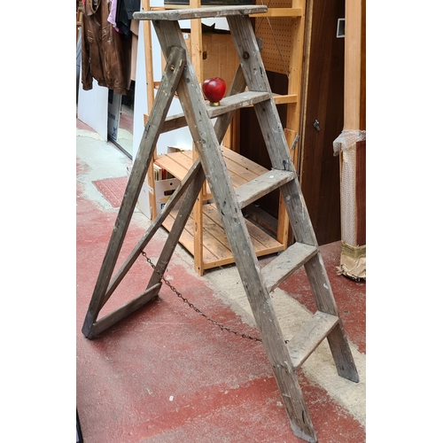 304 - A set of vintage wooden A frame 5 step ladders.