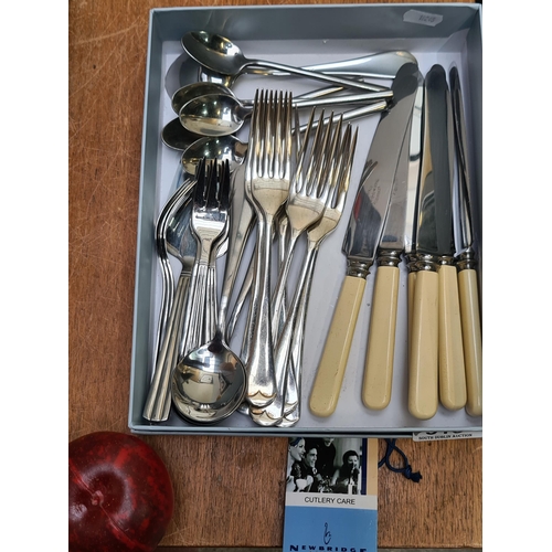 310 - A box of quality new bridge cutlery including Newbridge silverware and Viners. Includes a set of 6 k... 