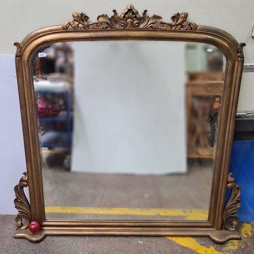 313 - Star Lot: A fabulous large Victorian style giltwood overmantle beveled glass mirror. In great condit... 