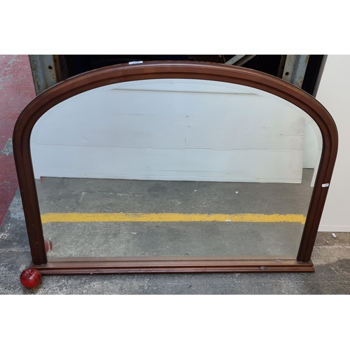 335 - A nice clean example of a large bevelled over mantel mirror housed in a neat wooden frame. MM: 82cm ... 