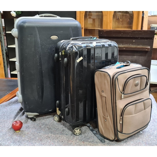 357 - Three suitcases including a hard-shell Top Move example (10kg) and a large Dustin 20kg example.