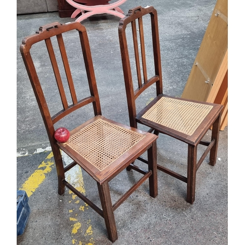 371 - A beautiful pair of Victorian dining chairs featuring woven wicker seat.