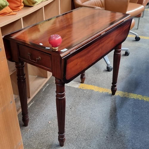 372 - A lovely mid century mahogany drop leaf dining table boasting exquisite reeded tapered legs and sing... 