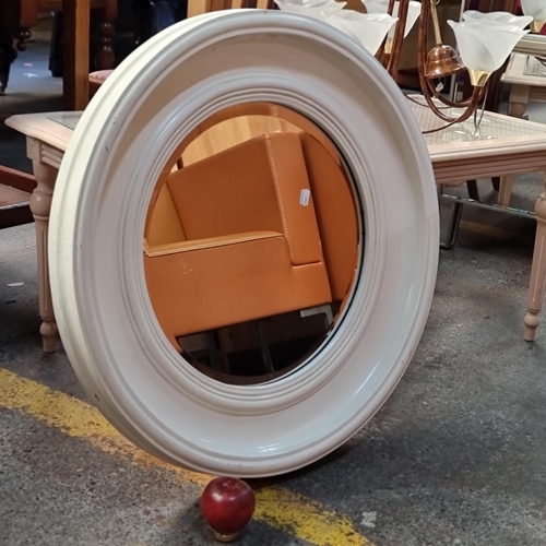 376 - A deep framed round wall mirror with bevelled glass.