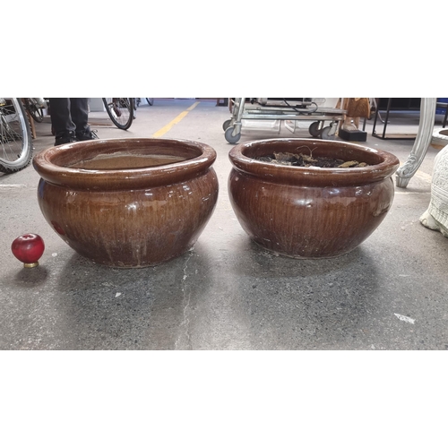 387 - A beautiful pair of large glazed terracotta plant pots. In wonderful rich earthy brown glaze. Heavy ... 