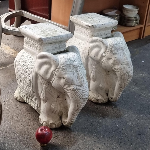 388 - A pair of very heavy reconstituted stone pedestal elephants.