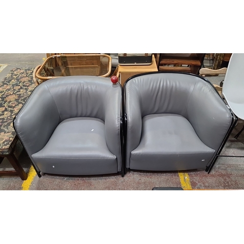 992 - Star Lot : Pair of modern grey leather club chairs with sleek black frames.
Previous in auction on 2... 