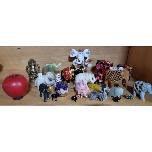 997 - Eclectic elephant figurine lot, featuring various materials and styles. Includes brass Ganesh statue... 