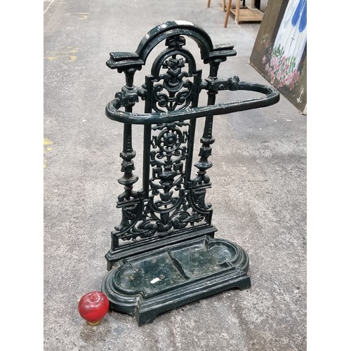 942 - Star Lot : An antique dark green very heavy cast iron umbrella / walking stick stand. In good order.