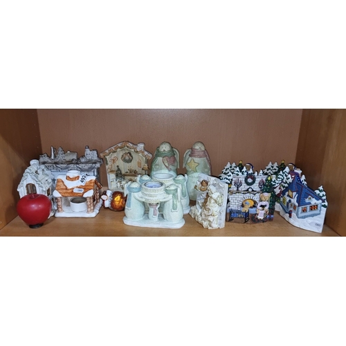 999 - Charming holiday figurine collection featuring snowmen, angels, and seasonal scenes.
Previous in auc... 