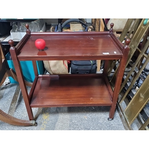 1046 - Vintage Mahogany Tea Trolley: Two-tier, mobile, with turned finials. Early 20th century.  from the f... 