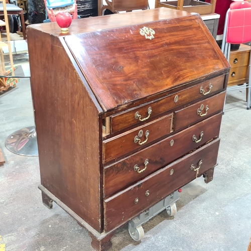 1066 - Star lot : A beautiful Georgian jamacian mahogany bureau with brass hardware. Approximately 100 cm h... 