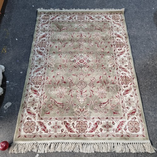 331 - A nice Antigua floor rug in nice natural colours 185cm x 120cm soft to the touch.