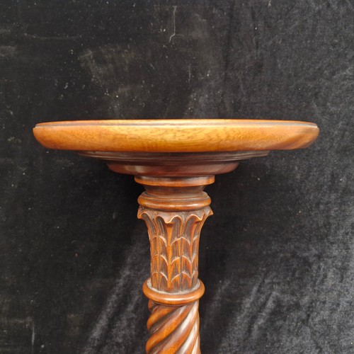 103 - A very handsome vintage intricately carved plant stand with tripod base. Features a barely twist col... 