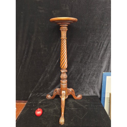 103 - A very handsome vintage intricately carved plant stand with tripod base. Features a barely twist col... 