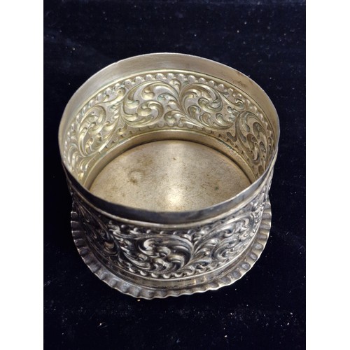 105 - A very pretty possibly Indian silver  lidded box featuring intricate floral and scrollwork design on... 