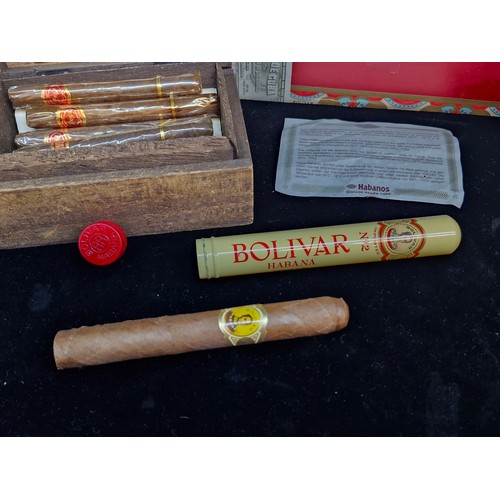 111 - A Bolivar Habana Havana Cuban box containing a Bolivar cigar, along with a Duya Cigarillos wooden ci... 