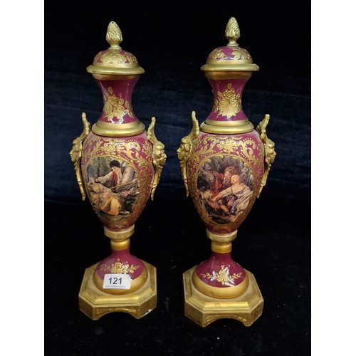 121 - Star Lot : A fabulous large pair of French Sevres style gilt and enameled brass vases.  Featuring ha... 