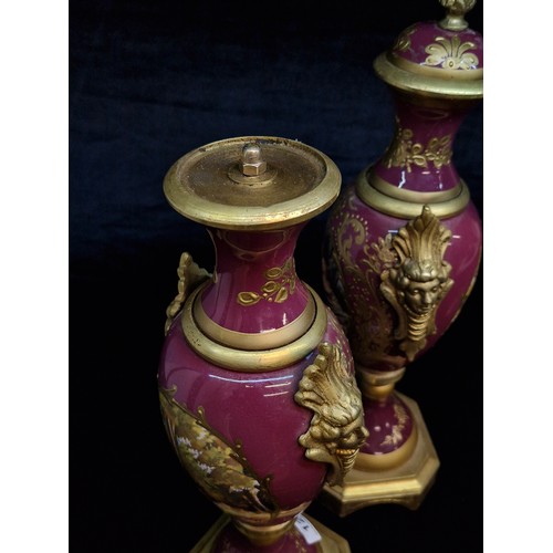 121 - Star Lot : A fabulous large pair of French Sevres style gilt and enameled brass vases.  Featuring ha... 