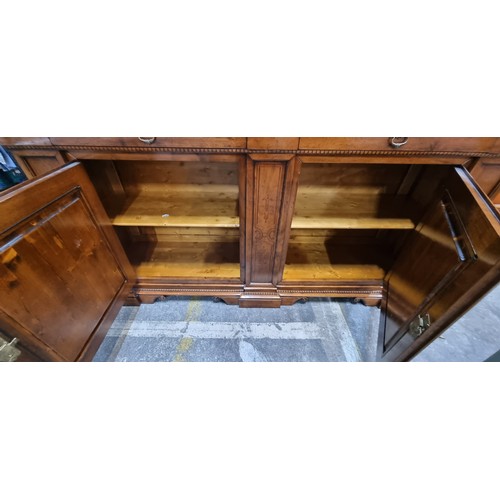 938 - Star Lot : A large oak Italian sideboard featuring exquisite inlaid panels, complemented by two eleg... 