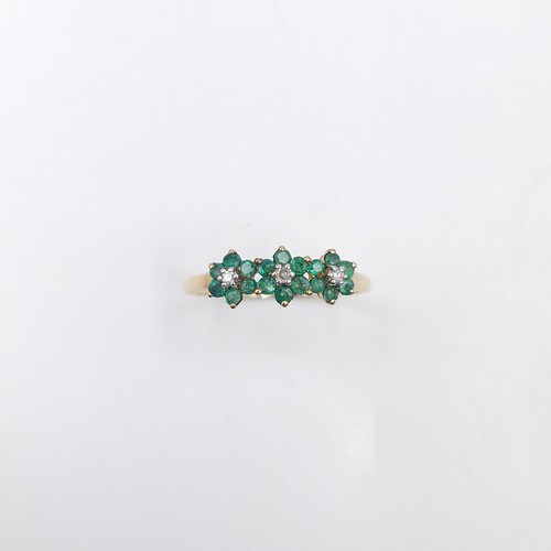 4 - Star Lot : A very pretty nine carat gold emerald & diamond ring. Weight - 1.65 grams. Size - R.