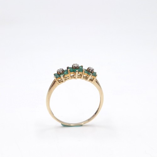 4 - Star Lot : A very pretty nine carat gold emerald & diamond ring. Weight - 1.65 grams. Size - R.