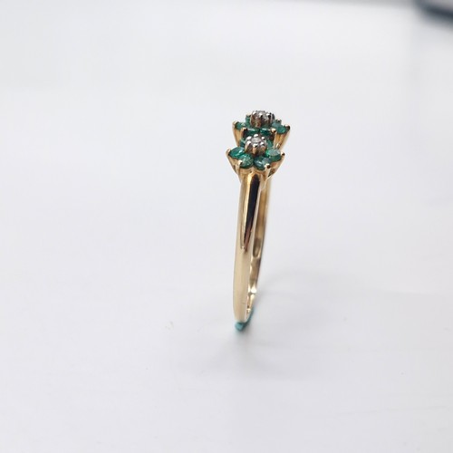 4 - Star Lot : A very pretty nine carat gold emerald & diamond ring. Weight - 1.65 grams. Size - R.