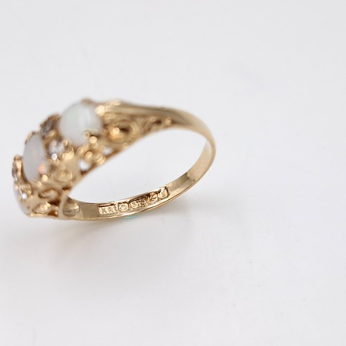 5 - Star Lot : A vintage nine carat gold three stone Opal ring set with diamonds. Size - M. Weight - 2.1... 