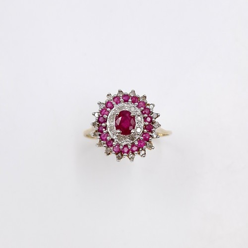 7 - A stunning and attractive central ruby gemstone ring with ruby & diamond surround set in nine carat ... 