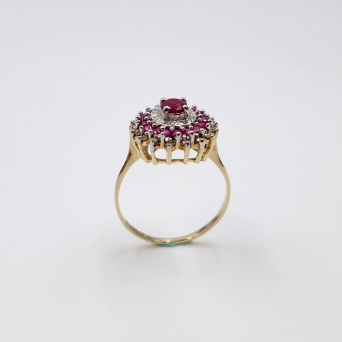 7 - A stunning and attractive central ruby gemstone ring with ruby & diamond surround set in nine carat ... 