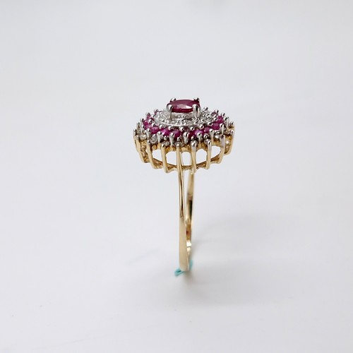 7 - A stunning and attractive central ruby gemstone ring with ruby & diamond surround set in nine carat ... 