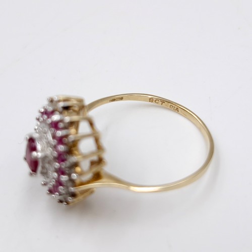 7 - A stunning and attractive central ruby gemstone ring with ruby & diamond surround set in nine carat ... 