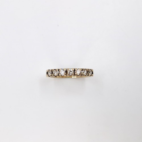 8 - A nine carat gold diamond half eternity ring, With 8 diamonds and .80 cts . Ring size - M. Weight - ... 