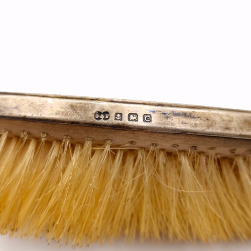 29 - Two sterling silver mounted hair brushes hallmarked Birmingham. As per photographed.